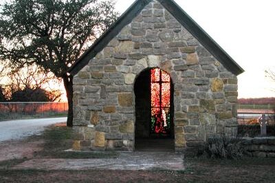 Small stone chapel with an arched doorway at the Buffalo Gap Cemetery